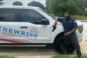 Furnace Troubleshooting in Grand Prarie,TX - Newrise employee standing next to Newrise company van