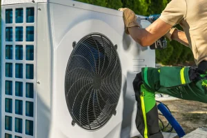 Technician testing HVAC system efficiency through diagnosis