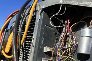 Experts in Heat Pump Repair in Arlington - Image of an open heat pump in the process of repair