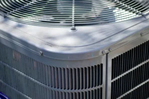 Inspecting an air conditioner identifying repair signs - Close up photo of an AC unit.